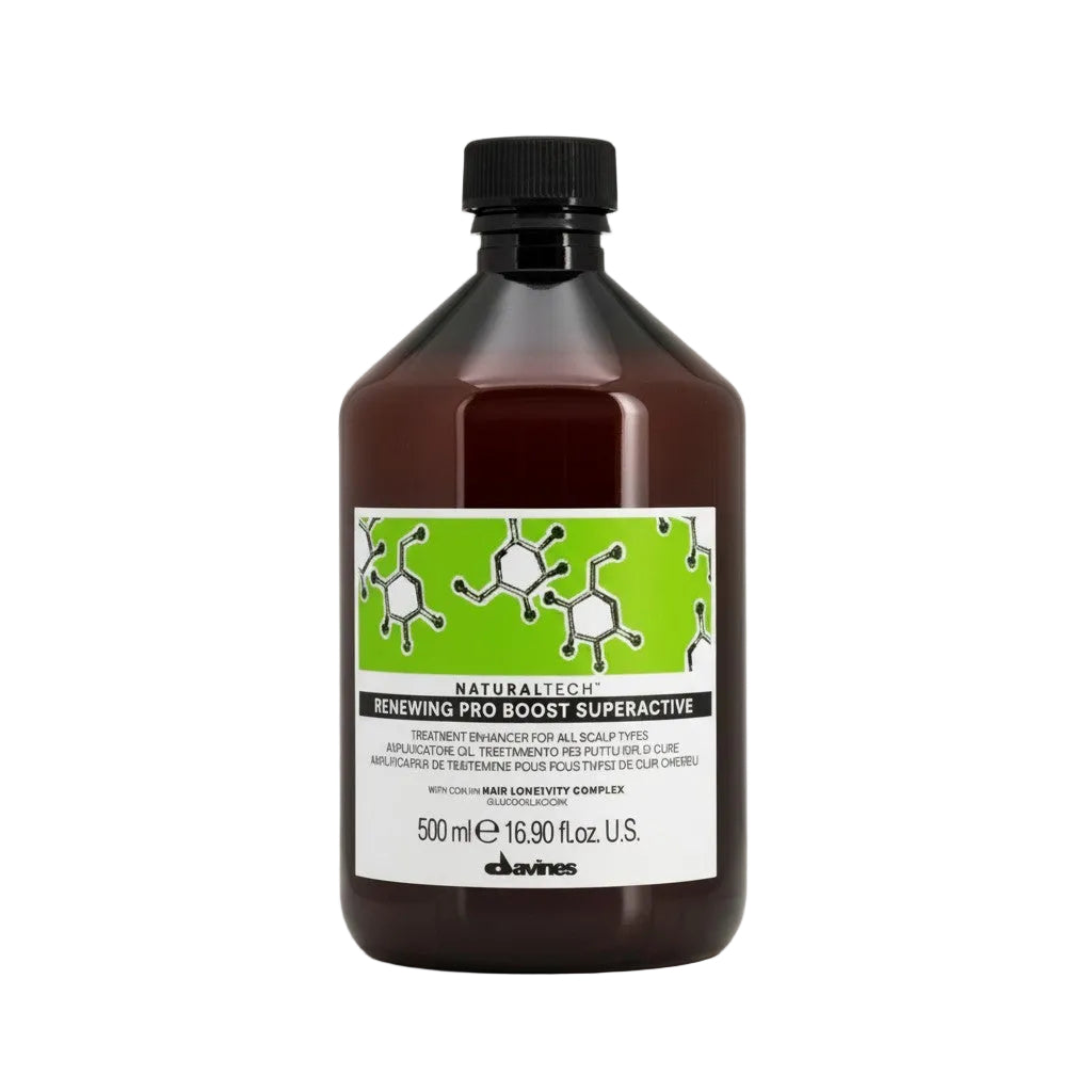Bottle of Davines hair treatment with a green label on a beige background