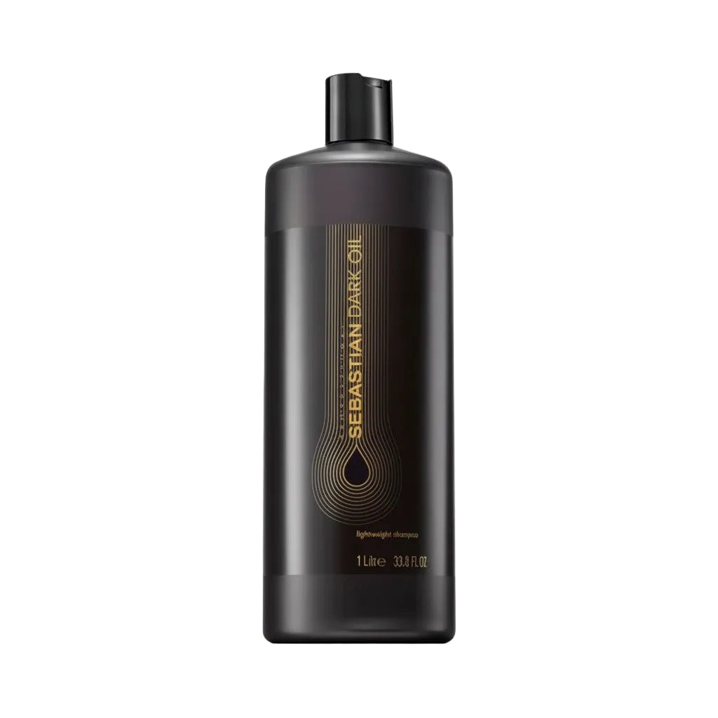Black bottle of Sebastian Dark Oil hair product on a white background