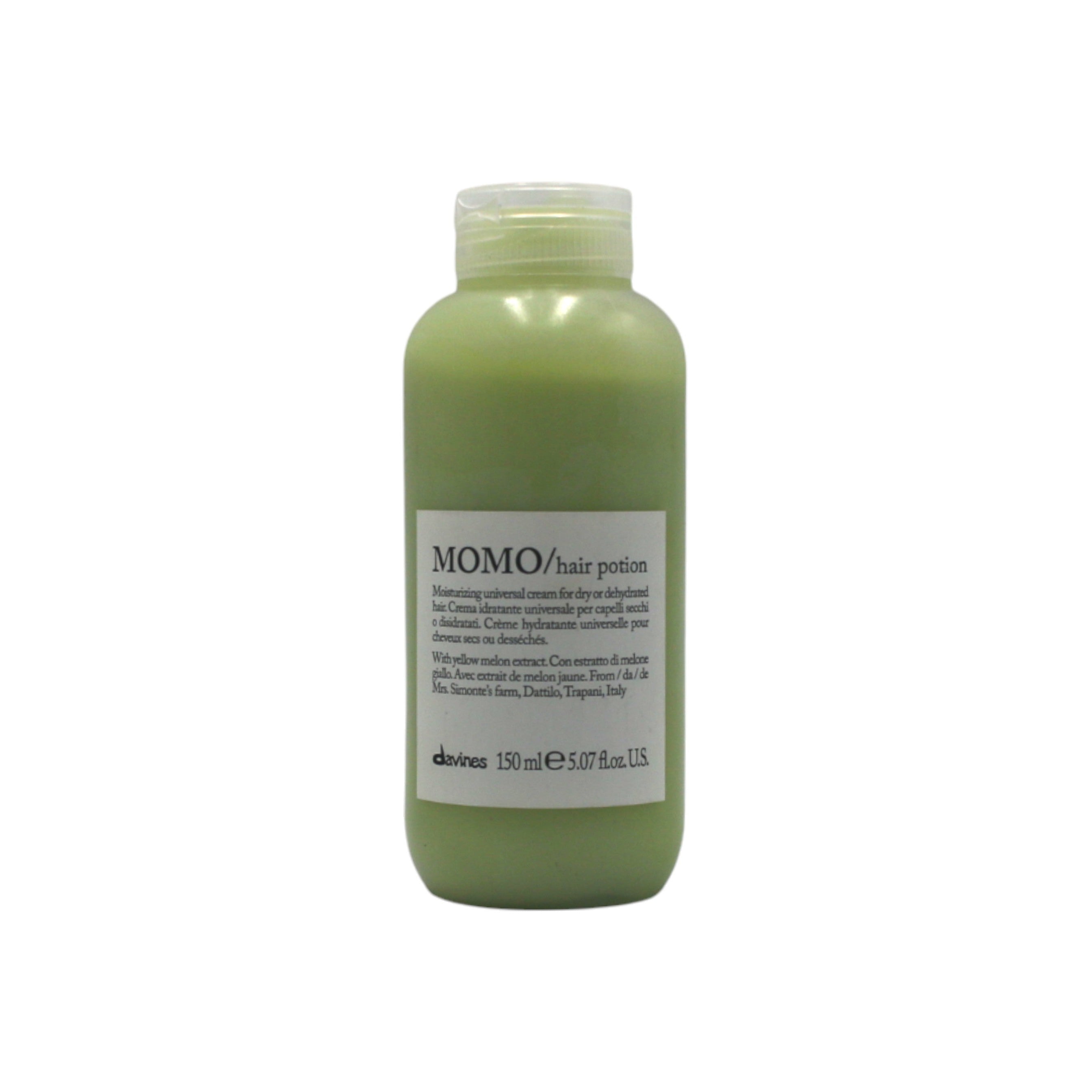 Green bottle of Momo hair product on a white background