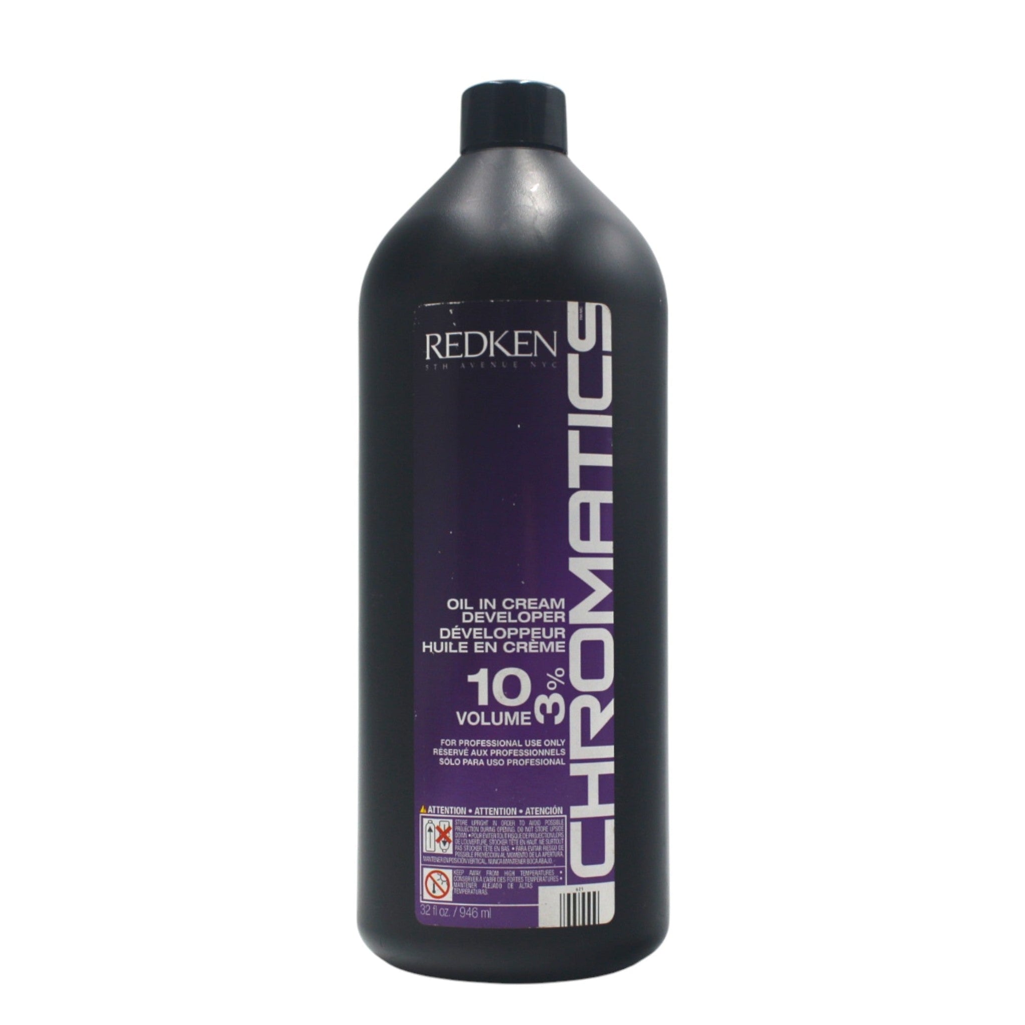 Redken Chromatics hair color bottle on a white background
