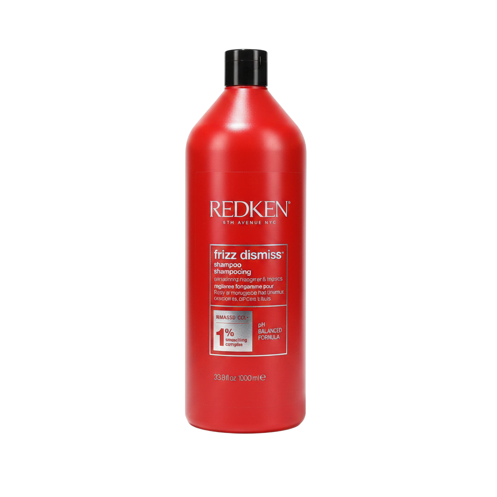 Red bottle of Redken frizz dismiss shampoo on a white background