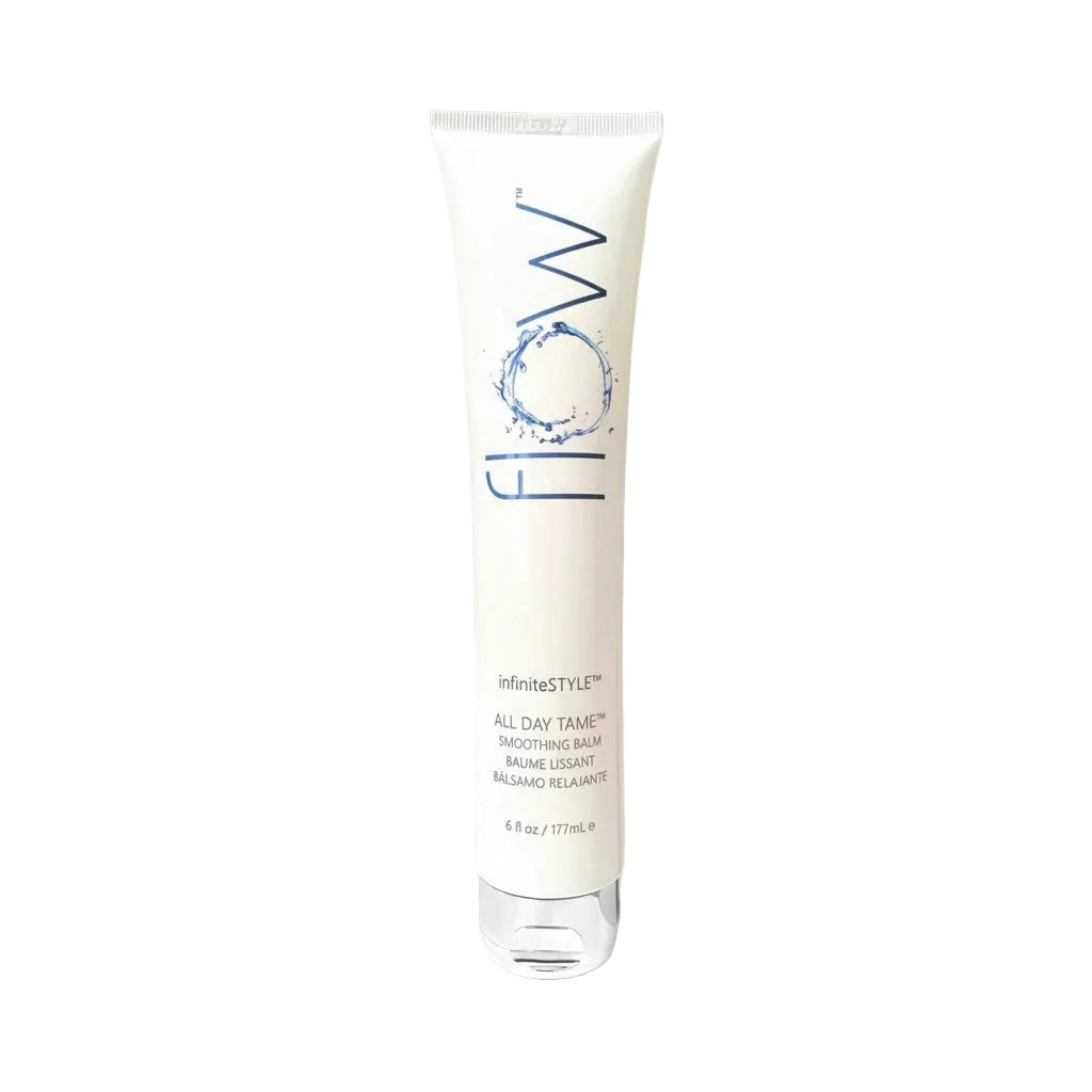 Tube of 'flow' hair product on a gray background