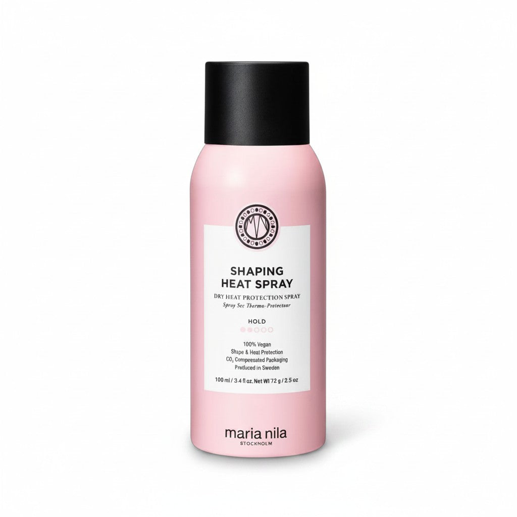 A pink bottle of Maria Nila Holding Heat Spray with a black cap and white label, photographed on a clean white background.