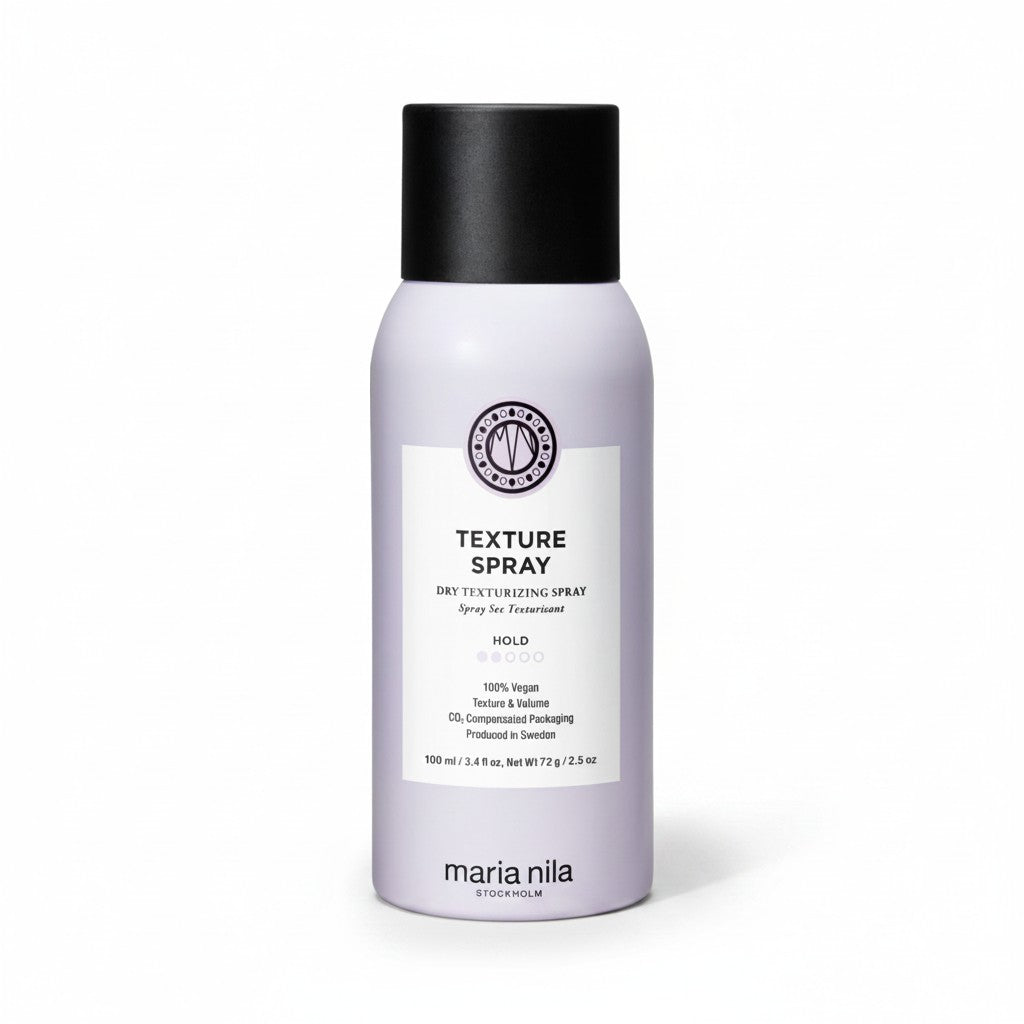 Maria Nila Textured Hair Texture Spray in a matte lavender bottle with a black cap and a white label, set against a plain white background.
